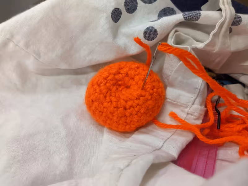 Tangerine bound in yarn